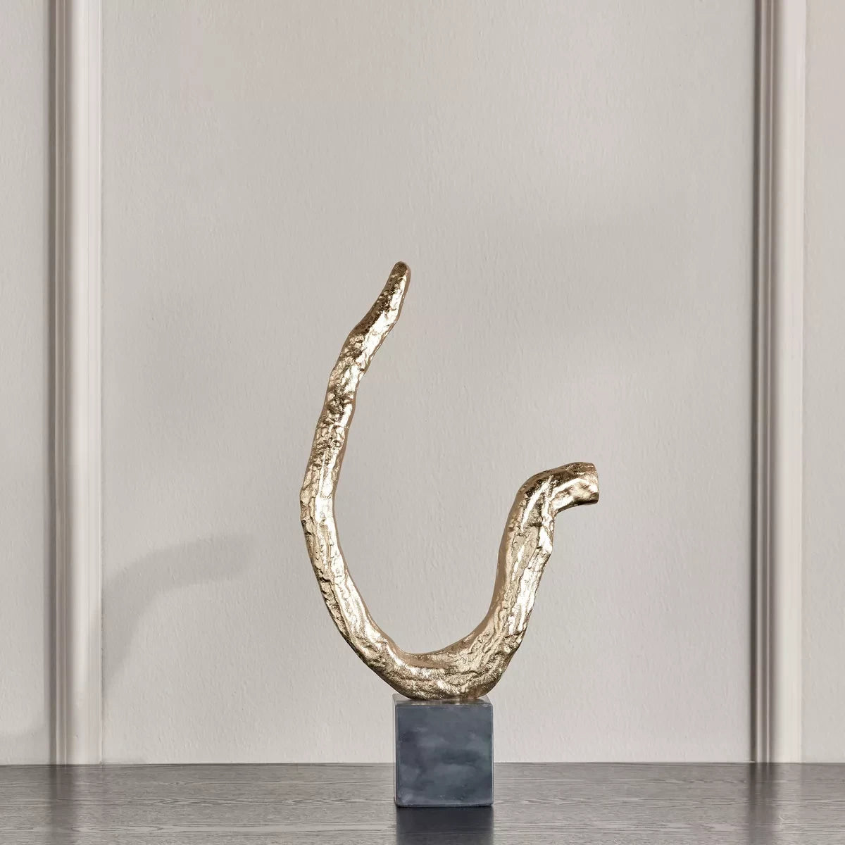 A decorative piece in the shape of a tree branch - Global Lux